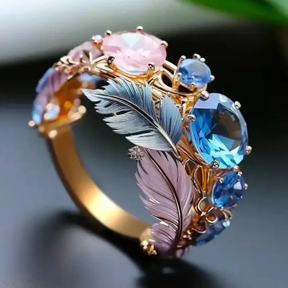 Gold Ring with Blue and Pink Accents.
